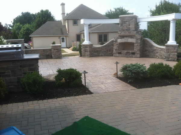 Rounded Pergola over Custom Stone Fireplace